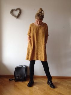 "Lovely oversized linen tunic with pockets and half length sleeves for everyday wear. This loose tunic is perfect with trousers and leggings or to wear as a dress. Great texture and lovely wrinkles. Made from high quality orange melange linen of medium-light weight. You can choose other colour and weight linens from our selection (see the last image). Each piece is individually cut, sawn and pre-washed. We really love making dresses for various sizes - from petit to plus size and more. For the b Tunic Tops Outfit, Linen Tunics For Women, Tunic Outfit, Tunics For Women, Tunic Sewing Patterns, Women Tunic, Plus Size Tunic, How To Wear Leggings, Linen Tunic Dress