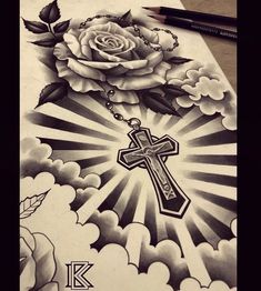 a drawing of a cross and a rose