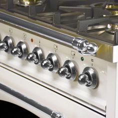 an oven with several burners and knobs on it