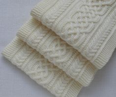 Hand knitted Long Scarf. Aran Wool Scarf in Off-White colour. Celtic motives. Approx. Size: 29 cm x 211 cm (11.4″ x 83.1″) Approx. Weight: 392 g (13.8 oz) This scarf is made of soft and very warm 100% wool yarn. This scarf knitted in a pet free and smoke free studio. Hand wash, max 40oC (104oF). Don't bleach. Don't use fabric softener. Dry Flat. This item is ready to be shipped. I will send you a tracking number when the item is shipped, so you can track your package. If you didn't receive your Cable Knitting Patterns, Scarf Knitted, Cable Knit Scarf, Scarf Wool, Christmas Scarf, Cable Knitting, White Scarves, Patterned Scarves, Warm Scarf