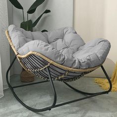 a chair that is sitting next to a potted plant