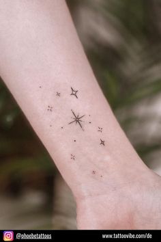 a small star tattoo on the wrist