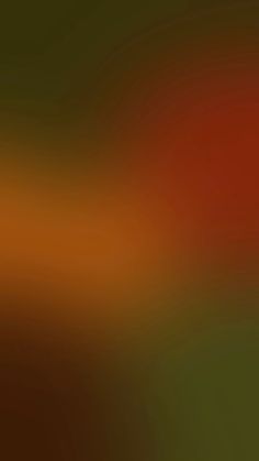 a blurry image of an orange and green background