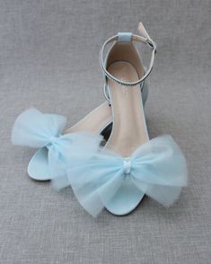 Classy satin block heel with rows of rhinestones on ankle strap and added soft tulle bow. Sparkly and glamour is great combination and will definitely be a favorite.** YOU CAN CHOOSE ANKLE STRAP OPTIONS AT CHECK OUT **DETAILS:FIT: RUNS LARGE, ORDER ONE SIZE DOWNHEEL HEIGHT: 2 inchesCOLORS AVAILABLE: White, Ivory, Light Blue, Dusty Pink, and NavyUPPER: Synthetic upper and liningMATERIALS: Mandmade outsole STYLE NAME: NAOMI Open Toe Tulle Heels For Party, Tulle Open Toe Heels For Party, Ankle Strap Tulle Heels For Parties, Tulle Ankle Strap Heels For Party, Spring Party Heels With Tulle Material, Formal Tulle Open Toe Heels, Spring Party Tulle Heels, Spring Formal Tulle Heels, Formal Tulle High Heels