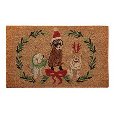 a door mat with an image of a dog and three other dogs in the center