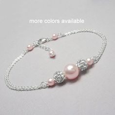 "Swarovski Light Pink Pearl Bridesmaid Bracelet, Bridesmaid Jewelry, Bridesmaid Gift Made with swarovski pearls, pave spacers and sterling silver chain Also available in other colors.  Please see color chart for options. BRACELET SIZE:  Please see sizing guide and select preference from drop down list Beautifully gift packaged, ready to gift. If you want the item gift packaged with a message, please type your message in the \"add your personalization\" box or in the \"add a note to alexandreasje Light Pink Jewelry, Bridesmaid Pearl Bracelet, Swarovski Pearls Bracelet, Bridesmaid Pearls, Bracelet Pearl, Purple Bracelet, Electroformed Jewelry, Beads Bracelet Design, Jewelry Bridesmaid