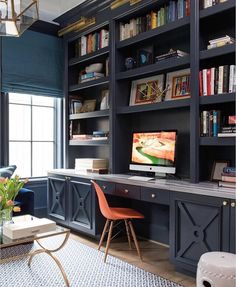 an image of a home office with bookshelves and desks on it's shelves