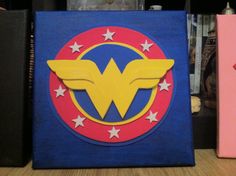 the wonder woman logo is painted on a canvas