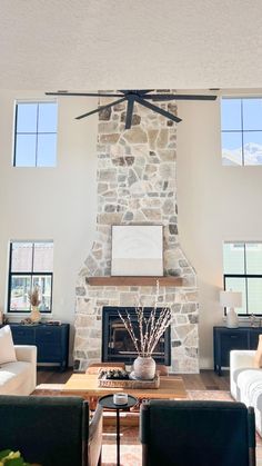 a living room filled with furniture and a fire place