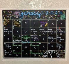 a chalk board with the calendar written on it