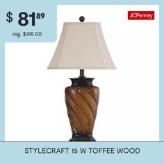 Showcasing an elegant design and rich, detailed finishes, this brown and white table lamp enhances the décor in a bedroom, office, or hallway. Displayed on a living room or dining room table, this lamp radiates soft light from the incandescent bulb housed inside the white fabric shade. The swirled frame features a gleaming toffee wood finish that matches the brown accents on the shade.Included: 1 Lamp Shade(s)Features: Twist(s), PedestalLight Bulb Base: E26 Medium (standard)Light Bulb Type: Inc… Brown And White Table, Wood Table Lamp, Lamps Table, Lamp Color, Table Lamp Wood, House Inside, White Table Lamp, Light Bulb Types, White Table