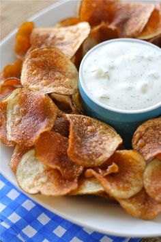 a plate with chips and dip on it