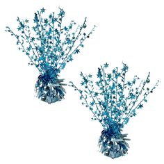 two vases filled with blue flowers sitting next to each other