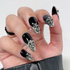 These Nail Gems Sets are great for getting a variety of nail decors in one package! This Vintage Silver Chrome Icons set includes 30 pieces of metallic crosses, Fleur-de-lis and stars, they are perfect for accessorizing Halloween nails, goth nails and the trendy chrome hearts nails. Shapes include: Crosses, Fleurs-de-lis and StarsSize: 5mm x 9mm ~ 10mm x 10mmPack of 30 pieces with 5 of each shape. Application: Apply a small amount of nail jewelry adhesive such as Stay Put Jewelry Gel or Brush-On Silver Chrome Hearts Nails, Goth Nail Charms, Gothic Chrome Nails, Goth Nails With Charms, Heartagram Nails, Gel Nails With Charms, Black Chrome Heart Nails, Goth Gel Nails, Nails With Cross Charm