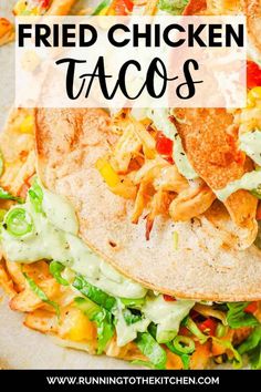 two chicken tacos are stacked on top of each other with the words, fried chicken tacos