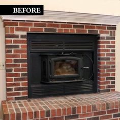 an old brick fireplace has been painted black