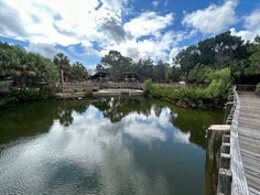 there is a wooden bridge over the water