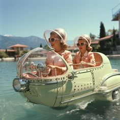 two women wearing hats and sunglasses ride in a small boat