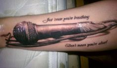 a person with a tattoo on their arm that says, you have your breathing don't mean you're alive