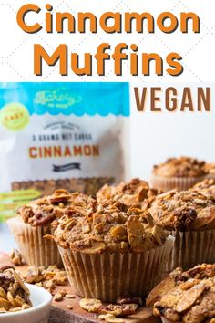 cinnamon muffins on a cutting board with a bag of granola in the background