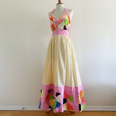 Vintage 1970s maxi dress by Georgia Charuhas, Boutique Las Marioposas, Merida Yucatan Mexico! A gorgeous collectible piece with a patchwork bodice trimmed in lace and a pale yellow pin tucked skirt edged with a deep band of quilted patchwork. The border has  padding for extra volume. Halter tie straps; back zip. 100% cotton. In very good condition, very clean and strong. Dress has one stain as shown on the skirt hem area; there are loose threads and some minor fraying to a few of the patchwork p Yellow Patchwork Maxi Dress, Pink Patchwork Maxi Dress, Retro Cotton Maxi Dress, Vintage Multicolor Patchwork Dresses, Merida Yucatan Mexico, Patchwork Dresses, Outstanding Outfits, Quilted Dress, Patchwork Clothes