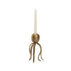 an octopus candle holder with a white candle