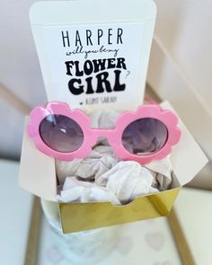 a pink flower girl sunglasses in a box