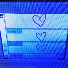 two hearts are drawn on the screen of a television