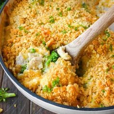 a casserole dish with broccoli and chicken in it, ready to be eaten