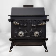 an old fashioned black stove with three burners