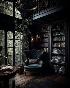 a chair and table in a dark room with bookshelves on either side of the window