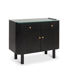 a black cabinet with two drawers and gold knobs on the front, against a white background