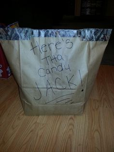 there is a paper bag with the words here's that candy jack written on it