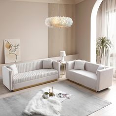 a living room with two white couches and a rug