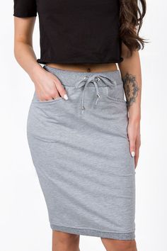 Sweatshirt skirt with elastic waistband and ties. The skirt has slip pockets. Elegant Sweatshirt, Skirt Model, Tie Skirt, Mode Online, Gray Skirt, Ruffle Dress, Karl Lagerfeld, Bottoms Pants, Outerwear Jackets