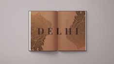 an open book with the word delhi printed on it's front and back cover