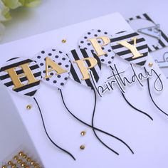 a happy birthday card with balloons and confetti