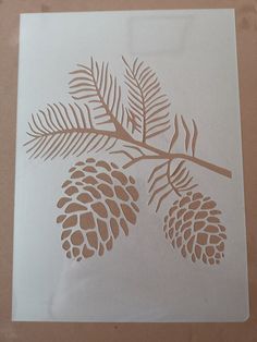 a piece of paper with some pine cones on it