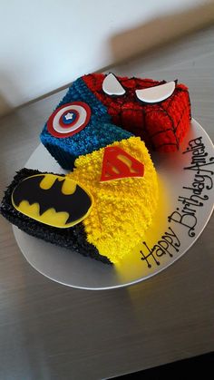 three birthday cakes decorated to look like superheros