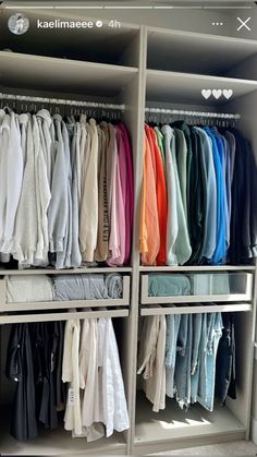 the closet is full of clothes and folded ones in different colors, shapes and sizes