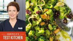 a woman standing in front of a pile of broccoli and cranberries