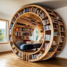 a circular book shelf in the middle of a room filled with books