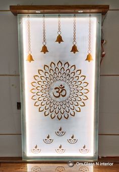 a white and gold wall hanging on the side of a building