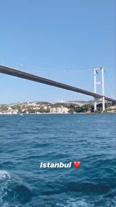 an image of a bridge that is over water with the word istanbul on it