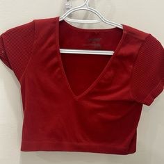 Buttery Material And Brand New Condition Red V-neck Crop Top For Spring, Cheap Red V-neck Top, Trendy Red V-neck Crop Top, Spring Red V-neck Crop Top, Red V Neck Top, Red V-neck Top From Urban Outfitters, Fitted Red V-neck Tank Top, Red Cotton V-neck Top, Red Cotton V-neck Crop Top