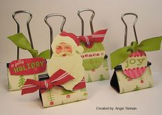 four christmas gift bags with santa clause on them