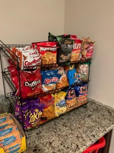 a bunch of food that is on top of a counter next to a basket with chips