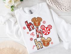 Festive "Ho Ho Ho" mouse-inspired digital download featuring gingerbread ears, candy canes, and snowflakes. Perfect for holiday sublimation designs on t-shirts and sweatshirts. Includes plaid, chevron, and peppermint patterns. Ideal for creating unique Christmas apparel. Transparent background for easy application. ✨💖 MYSTERY OFFER promotion 💖✨ See details in the shop announcement.  ------------------------- Check for more amazing sublimation designs here: https://www.etsy.com/shop/CutoDigital Peppermint Patterns, Christmas Disney Hoodies, Merry Christmas Disney Shirt, Christmas Disney Hoodie, Christmas Dosney Shirt, Long Sleeve Disney Christmas Shirts, Disney Attire, Christmas Apparel, Disney Trip Shirts