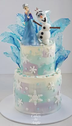 there is a cake decorated with frosting and decorations