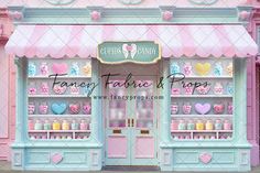 a pink and blue store front with hearts on it